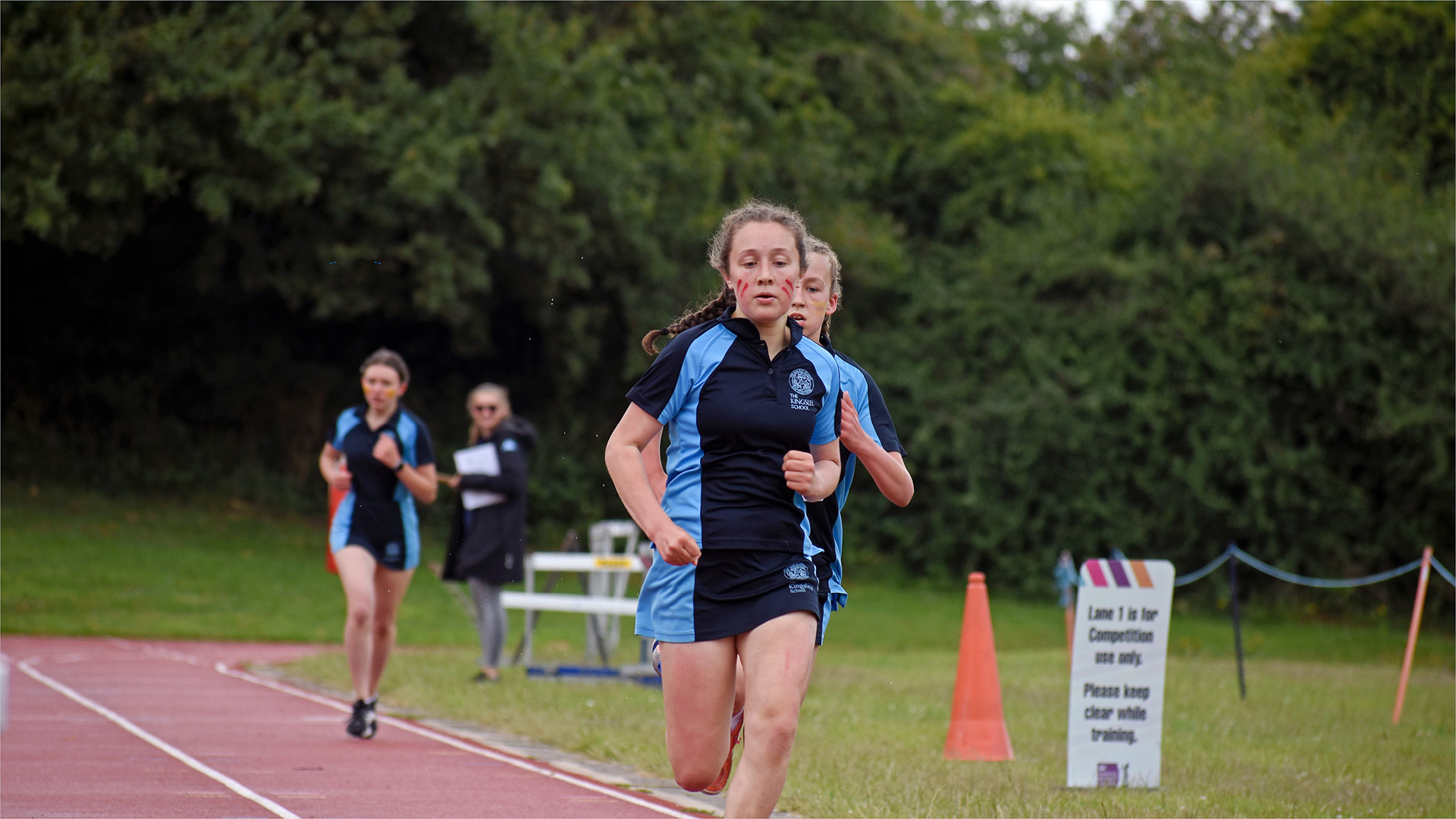 students running across the athletics track