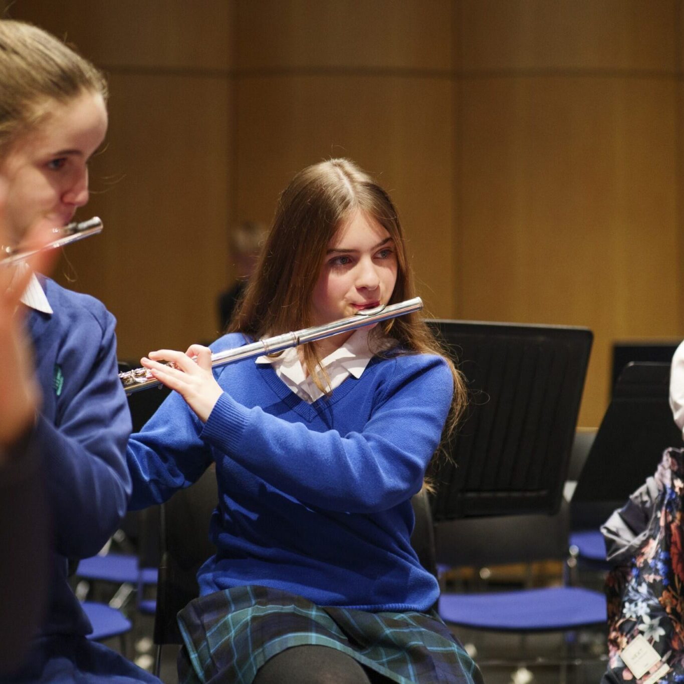 students playing flutes